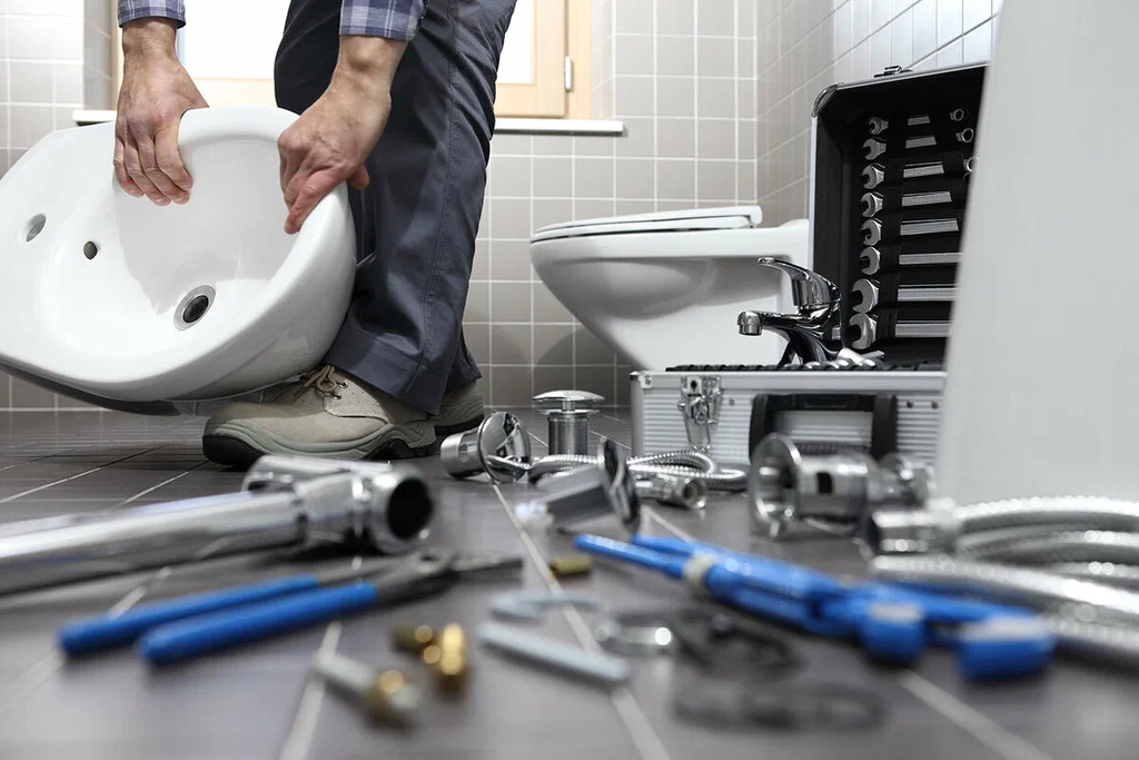 Plumbing tools prepared for a bathroom repair in West Valley City